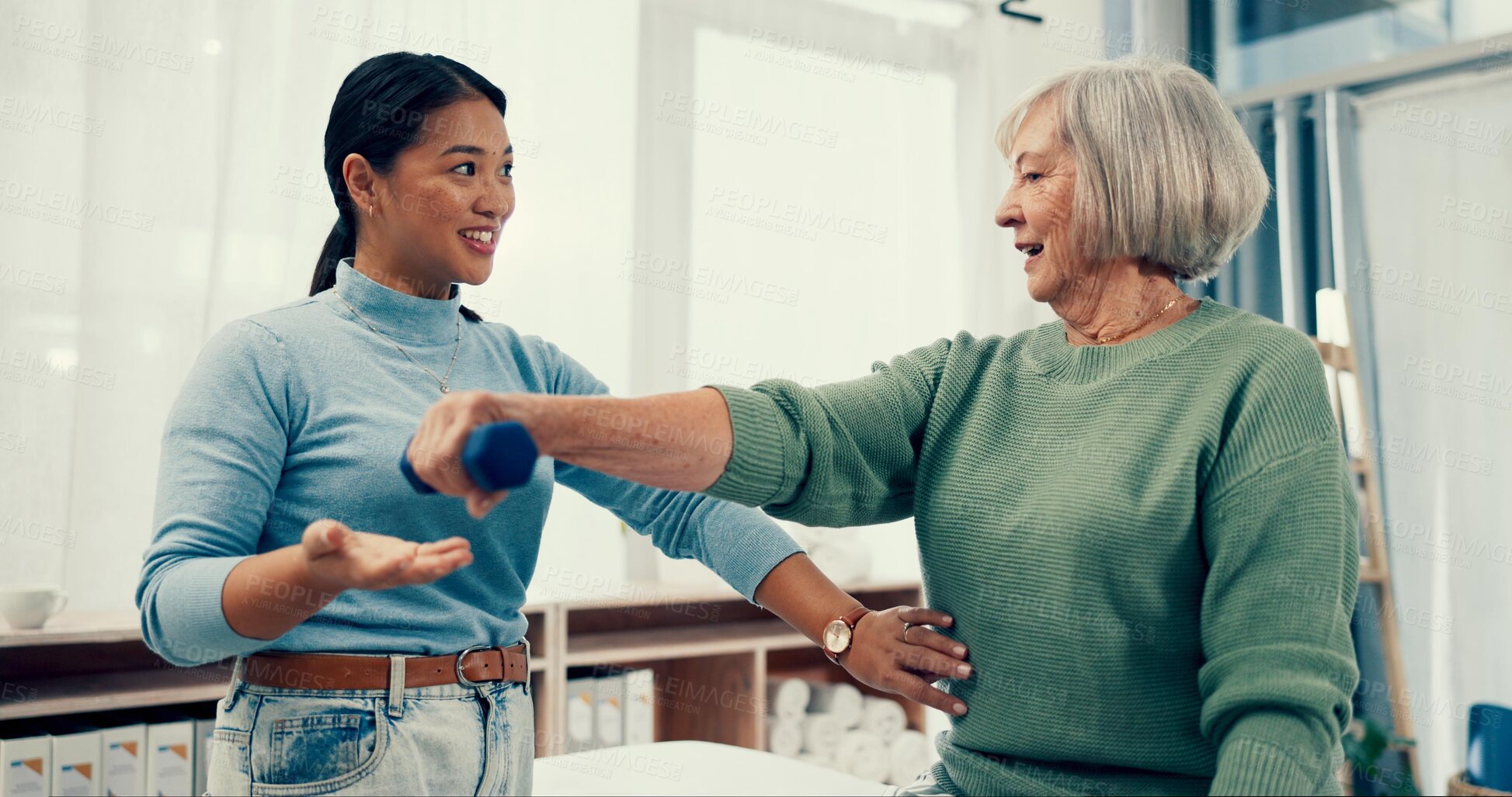 Buy stock photo Senior care, exercise and physiotherapist with old woman, dumbbell and healthcare for nursing. Physio, rehabilitation and retirement with fitness or caregiver and elderly patient mobility training