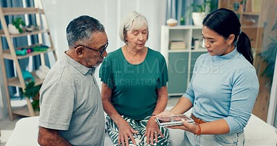 Senior physiotherapy, couple and a doctor with a tablet for a consultation and retirement healthcare. Rehabilitation, interracial man and woman speaking to a physiotherapist with tech for advice