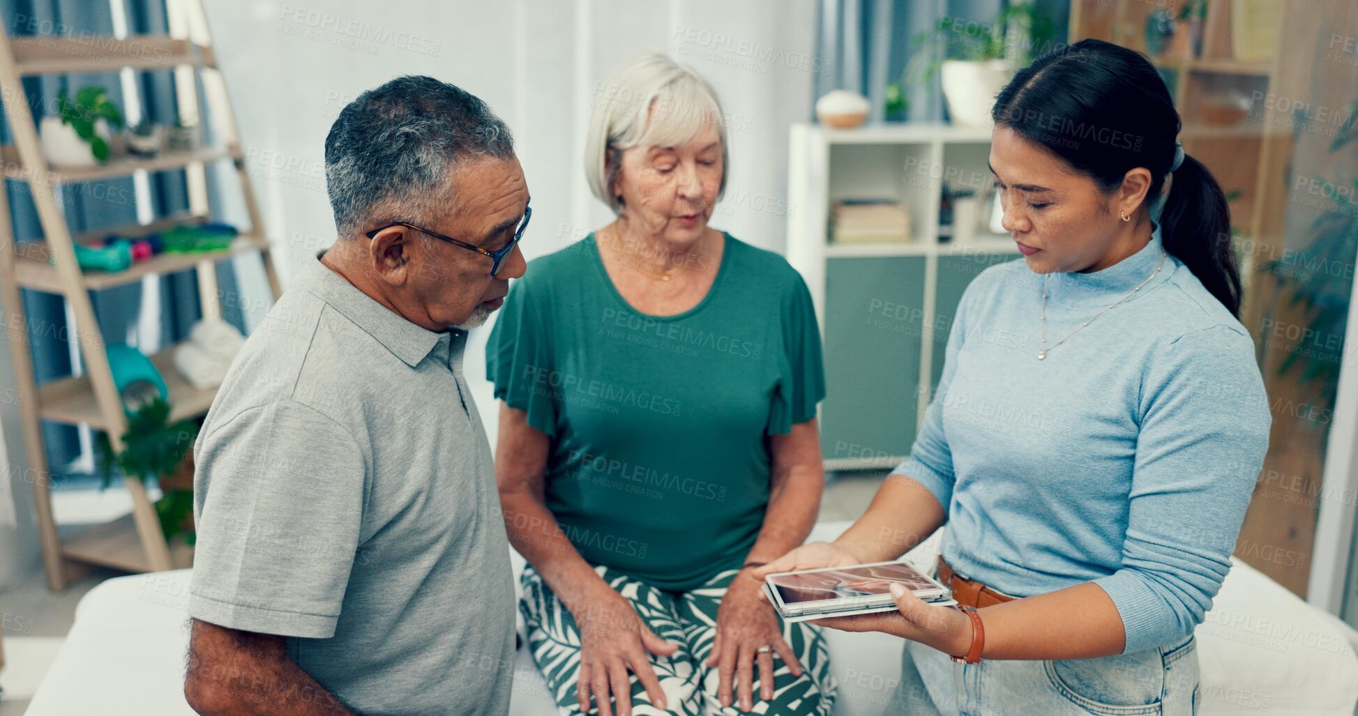 Buy stock photo Senior, physiotherapy and couple with doctor and tablet for a consultation and retirement healthcare. Rehabilitation, patient and woman speaking to a physiotherapist with tech for medical advice