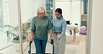 Woman, nurse and patient with walker in elderly care for physiotherapy or walking at the clinic. Female physiotherapist or caregiver assisting senior client or person with a disability in retirement