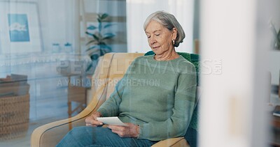 Senior woman, photograph and thinking of memory on a home sofa for nostalgia, history and to remember. An elderly female person with pictures of old album, nostalgia and photography in retirement