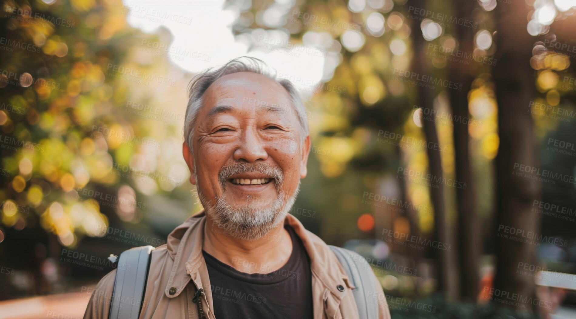 Buy stock photo Mature, man and portrait of a male laughing in a park for peace, contentment and vitality. Happy, smiling and chinese person radiating positivity outdoors for peace, happiness and exploration