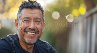 Mature, man and portrait of a male laughing in a park for peace, contentment and vitality. Happy, smiling and hispanic person radiating positivity outdoors for peace, happiness and exploration