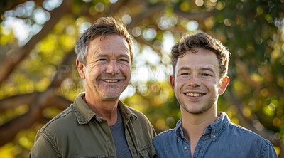 Mature, man and portait of a father and teen son posing together in a park for love, bonding and care. Happy, smile and people radiating positivity outdoors for content, happiness and exploration
