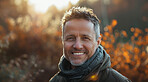 Mature, man and portrait of a male laughing in a park for peace, contentment and vitality. Happy, smiling and confident person radiating positivity outdoors for peace, happiness and exploration