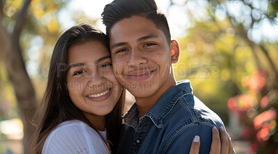 Young, couple and portrait of a man and woman posing together for love, bonding and dating. Happy, hispanic and romantic people radiating positivity outdoors for content, happiness and exploration