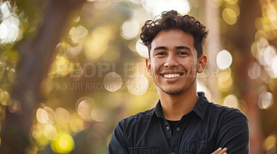 Young, man and portrait of a male laughing in a park for peace, contentment and vitality. Happy, smiling and confident latin person radiating positivity outdoors for peace, happiness and exploration