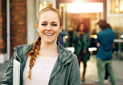 Buy stock photo Portrait of a happy young woman holding a laptop outdoors on campus
