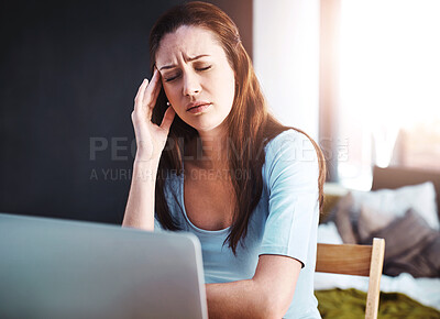 Buy stock photo Stress, remote work and woman with a headache working on a freelance project with a laptop. Burnout, sick and female freelancer with a migraine in pain doing research at her desk or workspace at home