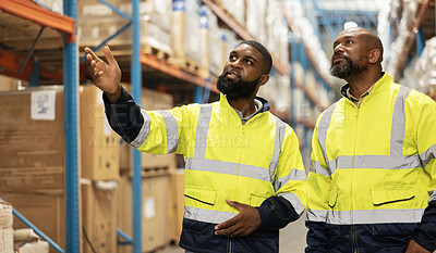 Teamwork, distribution and people in warehouse for inspection, storage facility and check stock. Collaboration, discussion and black man with manager for logistics, manufacturing and supply chain