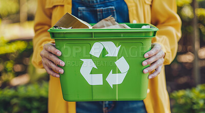 Hand, recycle and volunteer holding a dustbin for environmental, awareness and sustainability concept. Protest, plastic and green design with copyspace for Earth Day background, eco system or ecology