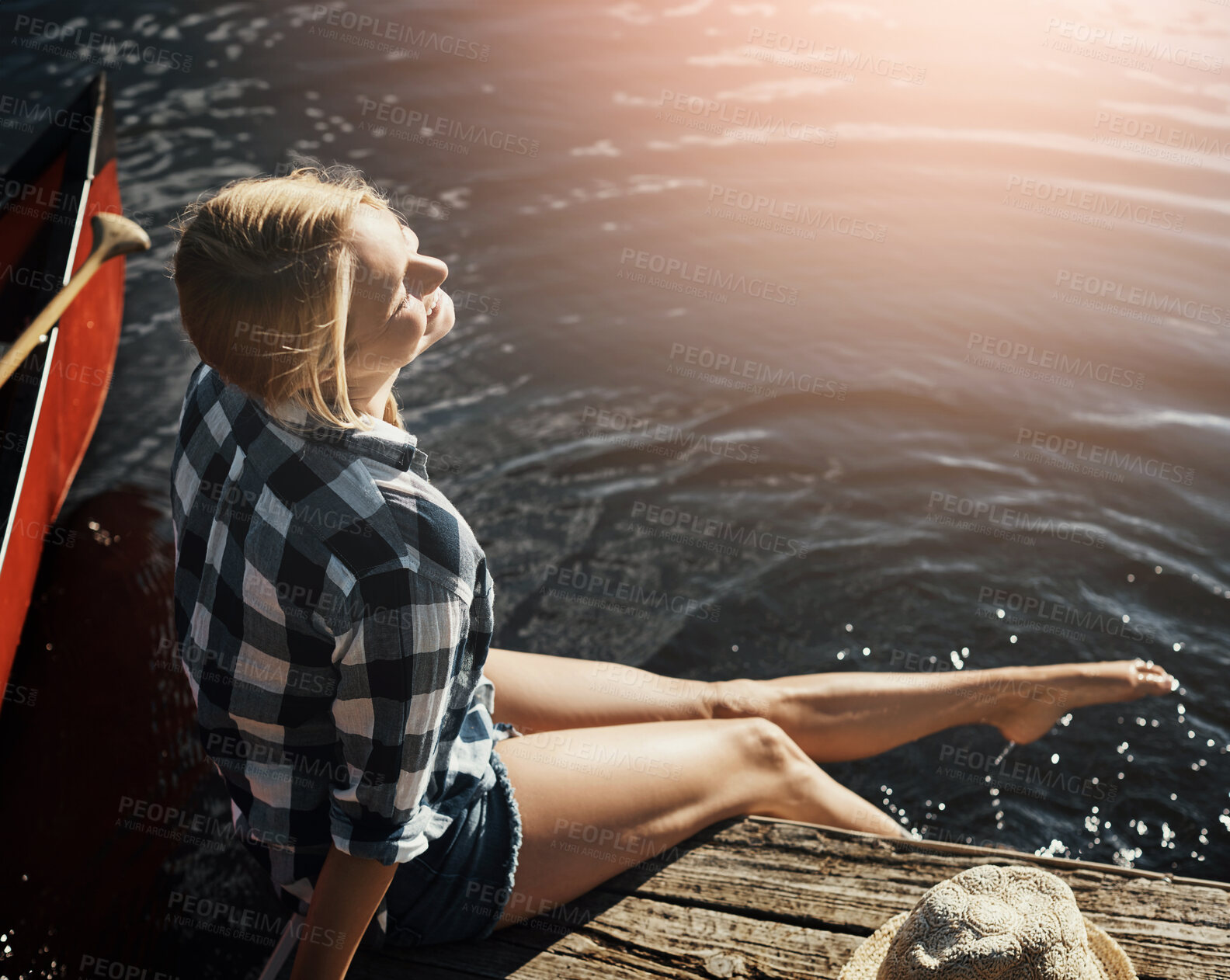 Buy stock photo Woman, lake and travel with feet in water, relax on vacation with freedom in nature for wellness. Female person, happiness and holiday by river with foot splash, kayak for adventure tourism in Canada