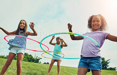 Buy stock photo Portrait, hula hoop and kids in park, girls and happiness with fun, bonding together and playful. Childhood, outdoor or friends with recreation, game or cheerful with weekend break, summer or leisure