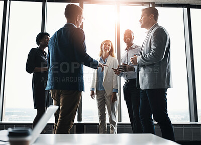 Buy stock photo Low angle shot of a group of corporate businesspeople meeting in their boardroom