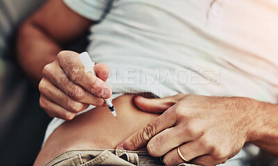 Buy stock photo Shot of an unrecognisable man about to take a shot of insulin as a daily routine for diabetes