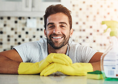 Buy stock photo Cleaning, kitchen and portrait of man with spray bottle for hygiene, disinfection and washing. Housekeeping, housework and person with detergents for cleaner service, maintenance and wellness in home