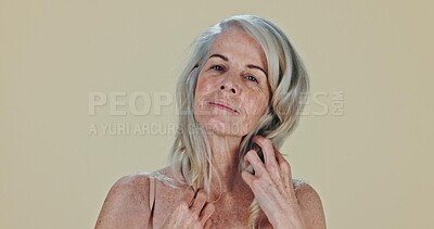 Face, skincare and senior woman with confidence, smile and cosmetics on a studio background. Portrait, model and pensioner with texture, volume and elderly person with grooming, wellness and luxury