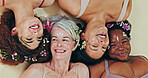 Diversity, face flowers and women relax for self love, natural facial beauty and solidarity. Woman empowerment, creative eco design and floral group, friends or people on floor on studio background