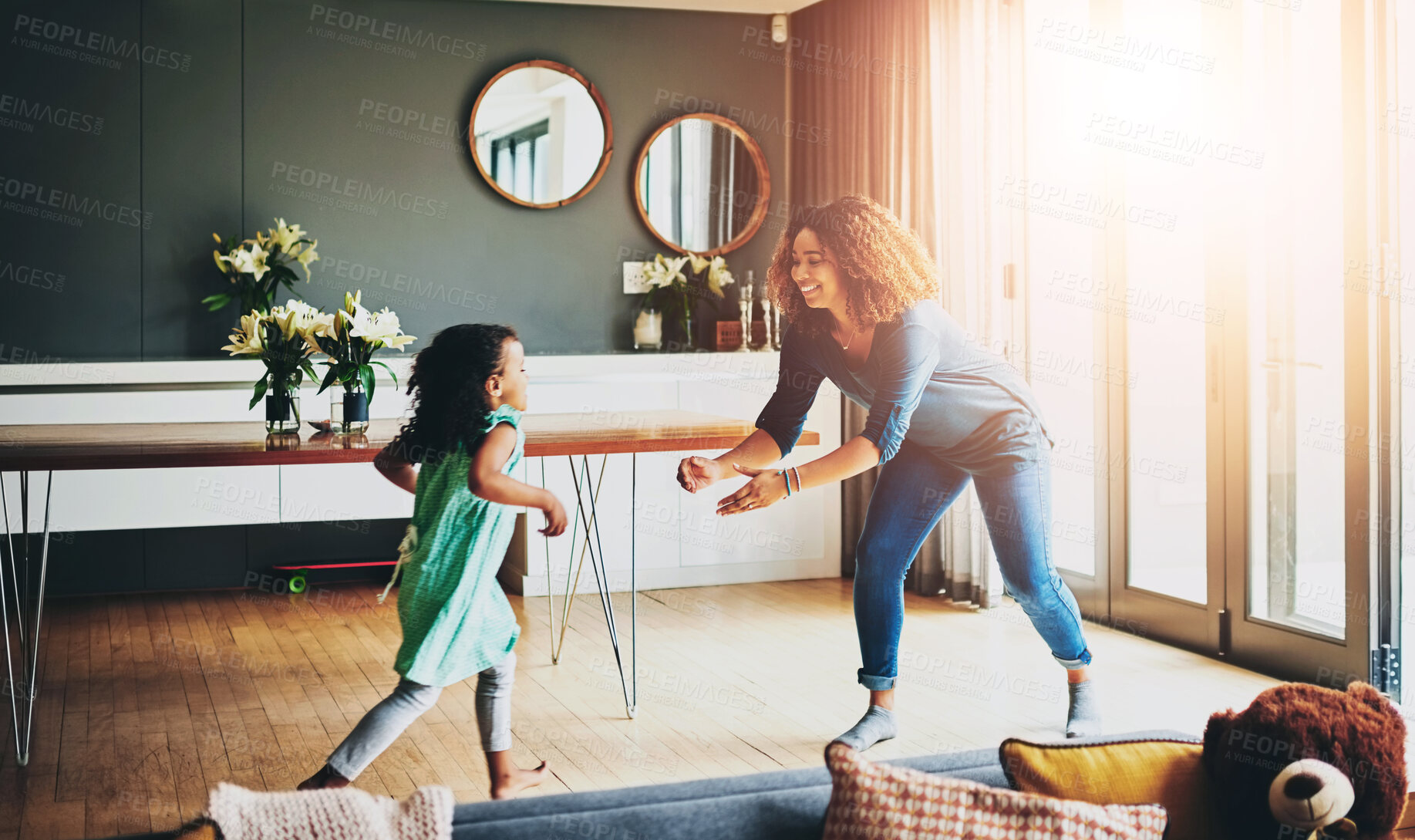 Buy stock photo Love, girl and running to mom in living room with child for playing, fun activity or family. Lens flare, happy parent and kid daughter with care for support, relationship or bonding together in home