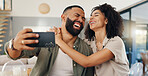 Home, selfie and couple with love, funny and smile with happiness and social media in a living room. Apartment, man and woman in a lounge, profile picture and humor with laughing and bonding together