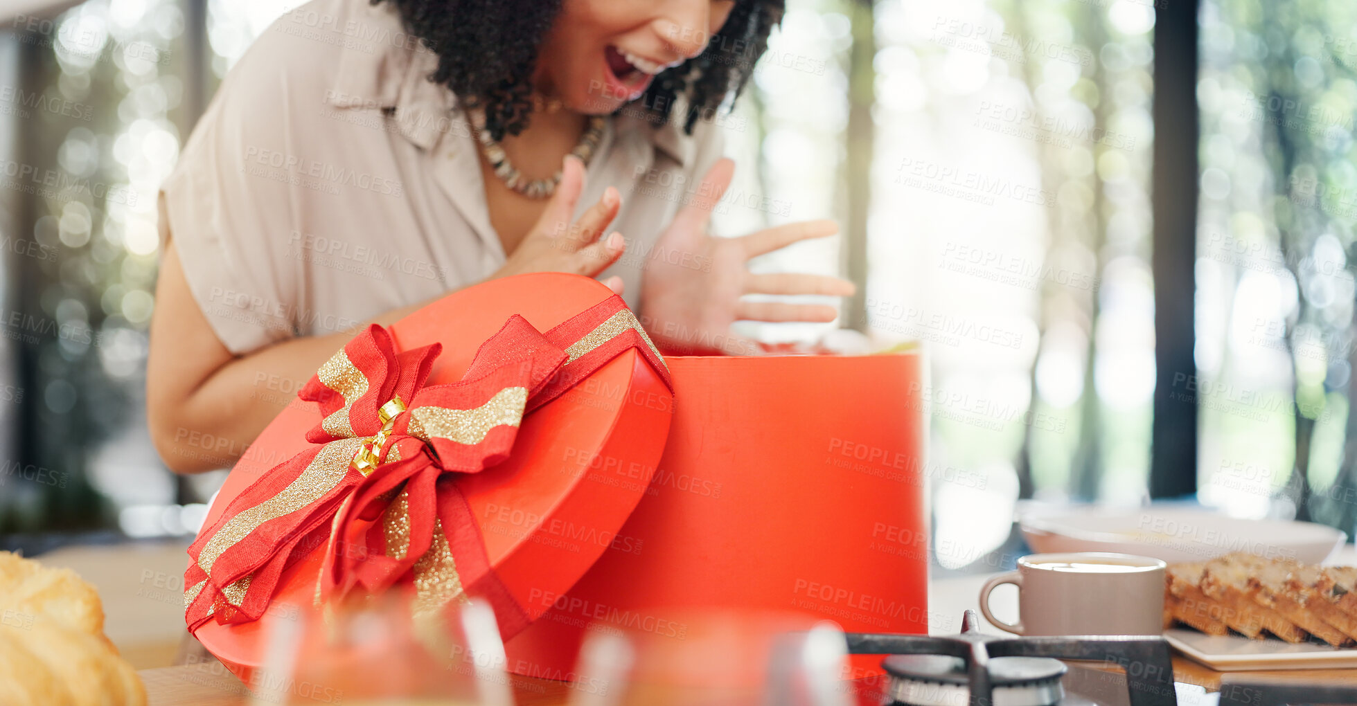 Buy stock photo Woman, excited and open gift box in home with surprise, romance and love in marriage on valentines day. Lady, nervous and shake a red present for anniversary, care and gratitude by kitchen counter