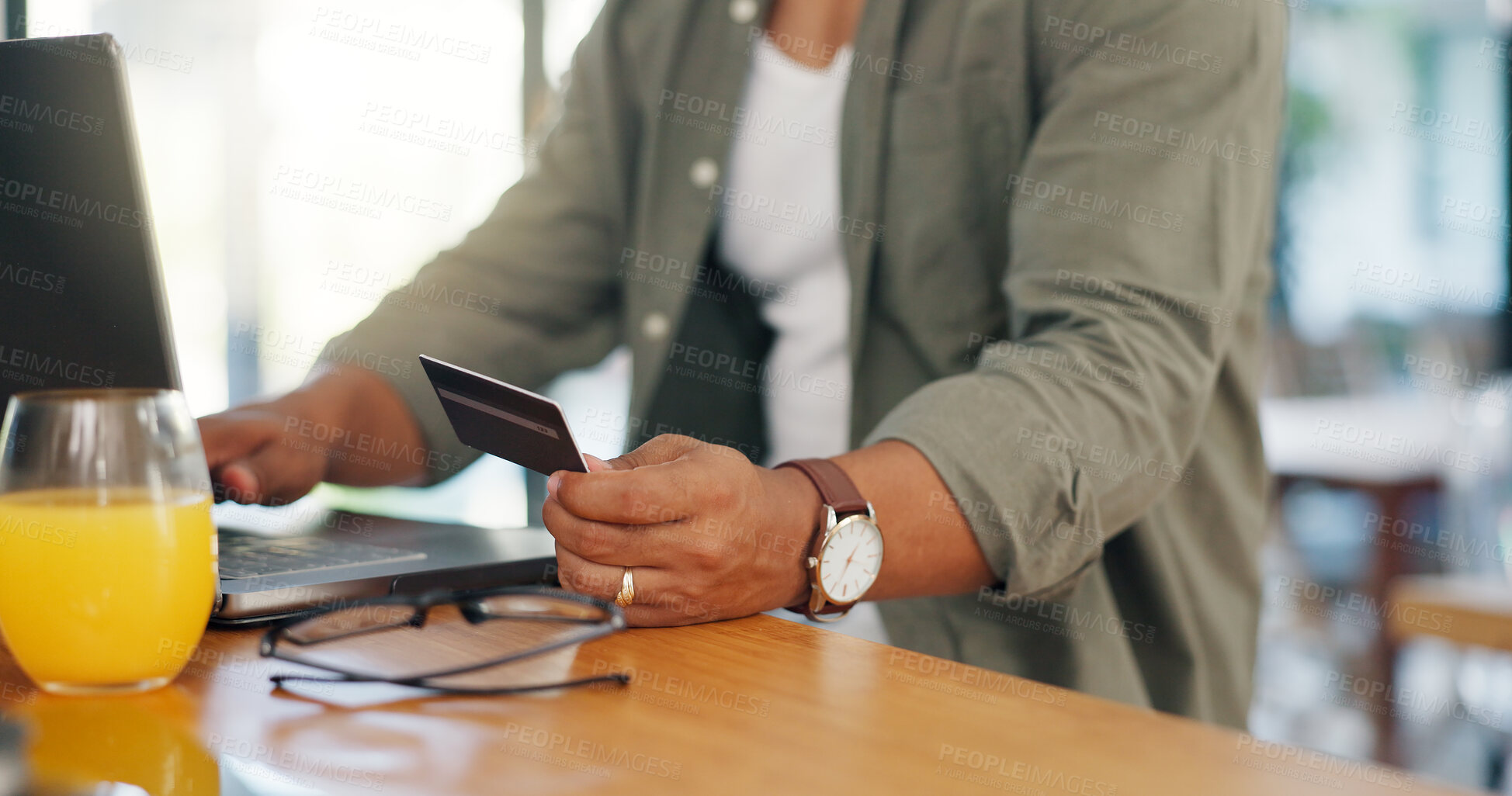 Buy stock photo Man, credit card and laptop at desk for successful online shopping, gambling or subscription at home. Male person, technology and hands gesture for ecommerce, booking or payment for traveling