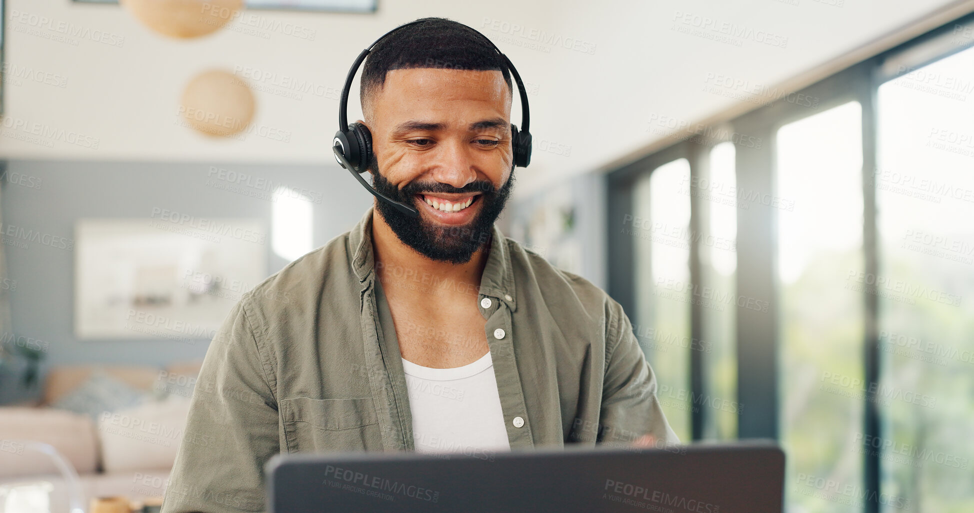 Buy stock photo Man, headset and talking in home on video call, live streaming and presentation in online conference. Remote work, laptop or virtual assistant for contact centre or customer support at kitchen table