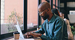 Business, laptop and black man thinking in cafe, idea and typing email for remote work. Dream, vision and freelance professional on computer, serious editor and person writing article in coffee shop