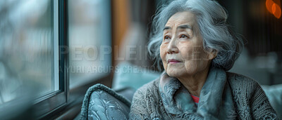 Thinking, thoughtful and senior Asian woman in retirement home, reflection and remembering past life. Elderly, pensioner and contemplating future or memory, nostalgia sitting on couch with window