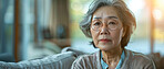 Portrait thinking and senior Asian woman in retirement home, reflection and remembering past life. Elderly, relax and contemplating future or memory, nostalgia and wellness in apartment on couch