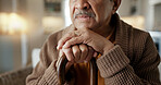 Depression, nostalgia and a senior man with a cane on a sofa in the living room of his retirement home alone. Memory, thinking and an elderly person with a walking stick in a house feeling sad
