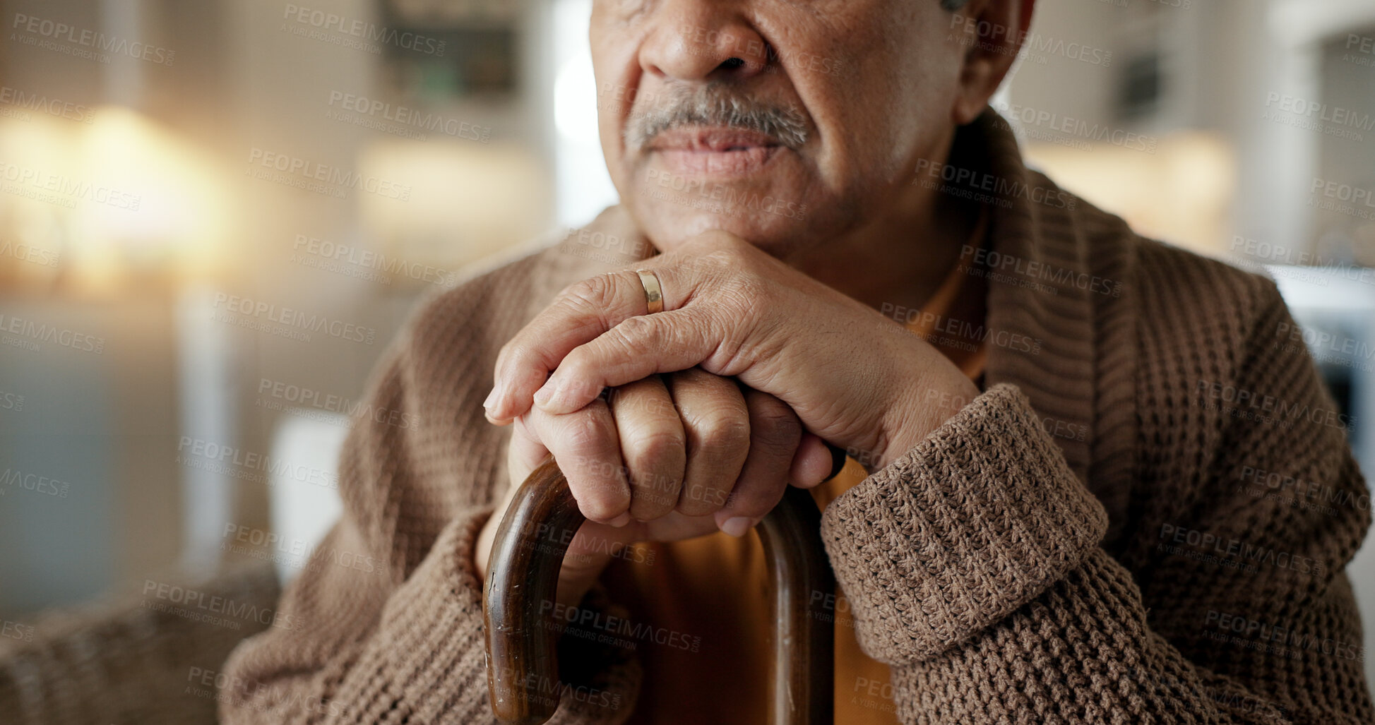 Buy stock photo Depression, nostalgia and a senior man with a cane on a sofa in the living room of his retirement home alone. Memory, thinking and an elderly person with a walking stick in a house feeling sad