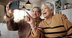 Senior couple, selfie and happy on sofa, hug or talking for choice, check post and point for photography in home. Elderly woman, man and laugh with profile profile, web blog and social media on couch