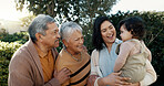 Mother, baby or grandparents hug in park for bonding, support or love in a happy family. Old man, mature woman or mom with a young daughter in outdoor garden or nature together on holiday vacation