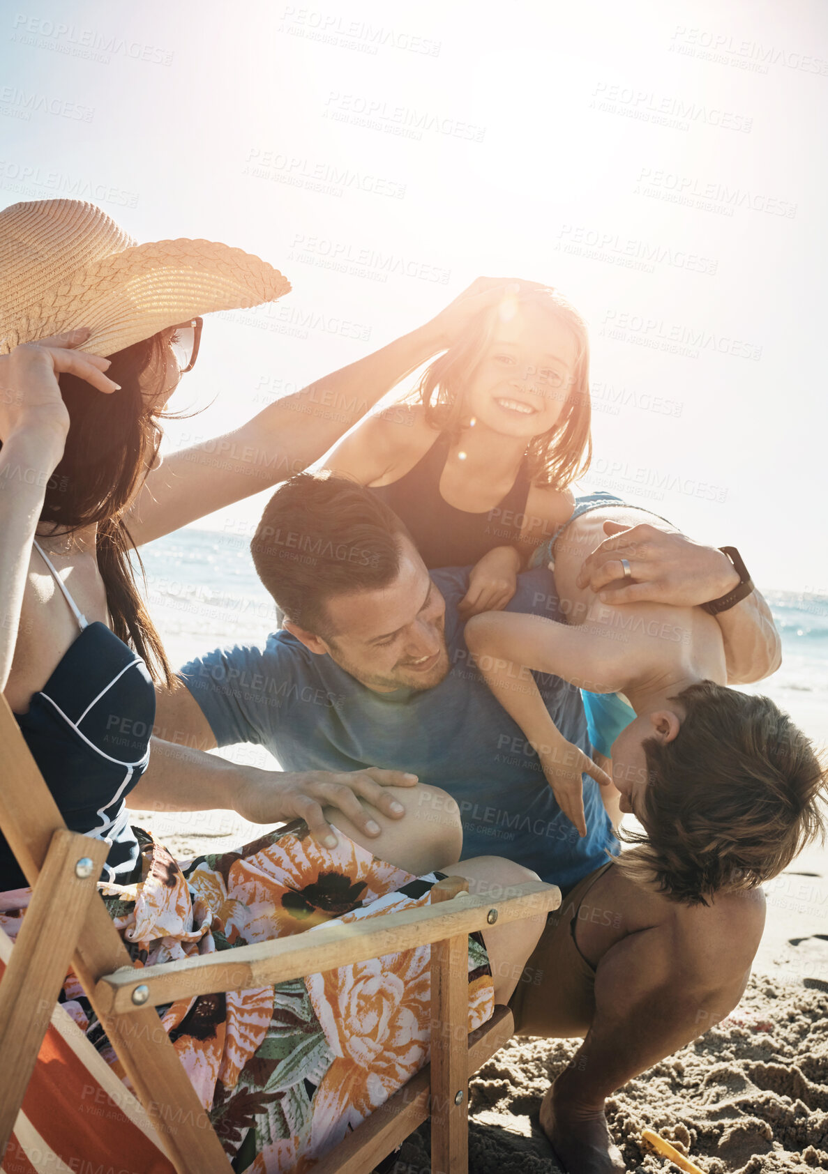 Buy stock photo Family, beach and parents with kids, playful and bonding together with vacation, relax and ocean. Seaside, mother and father with children, active and adventure with holiday, getaway trip and travel