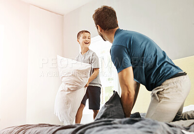Buy stock photo Shot of a young boy and his father spending some quality time at home