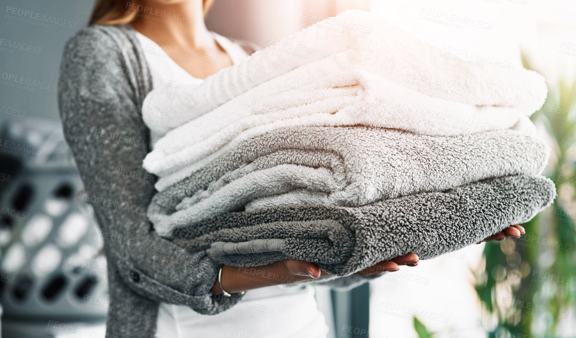 Buy stock photo Housekeeping, hands of woman and towels at house for hygiene, fabric and organizing at home. Cleansing laundry, folded cotton and person at laundromat for spring clean, sanitary and textile in stack