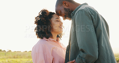 Couple, sunlight and forehead touch in nature for bonding together, love and happy in marriage. Interracial people, holiday and commitment in relationship, partnership and hug or loyal in outdoors