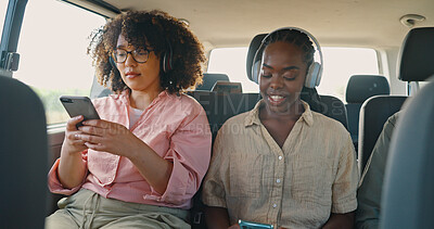 Phone, music and friends in car for road trip, travel or journey together on summer vacation. Smile, social media and headphones with young women on mobile app in vehicle for holiday transportation