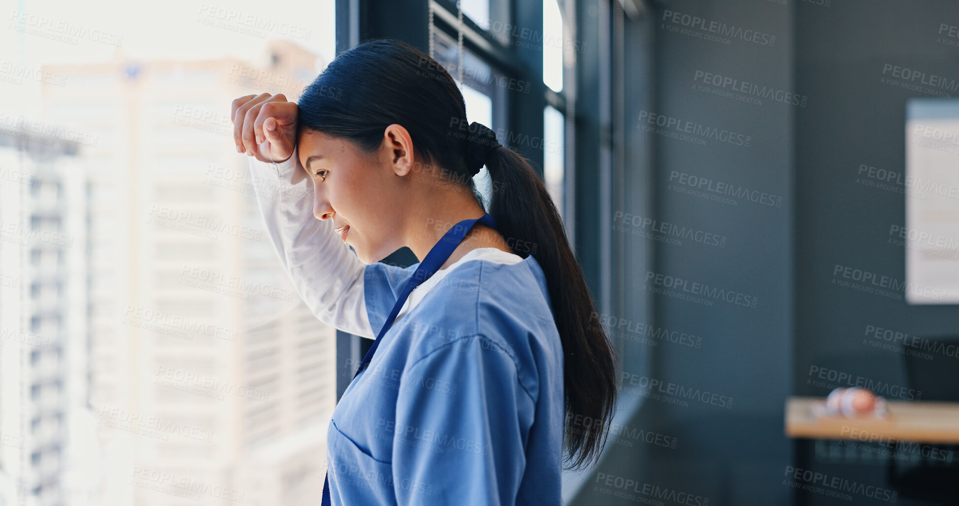 Buy stock photo Nurse, healthcare and thinking at window of hospital with depression, medical decision and burnout. Medicine, woman and thoughtful professional doctor in clinic with mental health, stress and anxiety