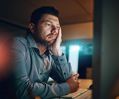 Buy stock photo Bored, night and business man at desk by computer for fatigue, overtime or project deadline in office. Tired, publishing agency and employee for exhausted, reading online report or decision in dark