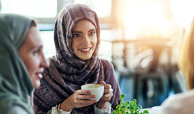 Buy stock photo Friends, smile and Muslim women in coffee shop, bonding and talking together. Cafe, happy and Islamic girls, group or people chatting, conversation and discussion for social meeting in restaurant.