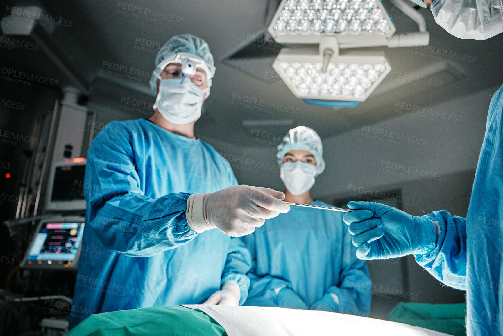 Buy stock photo Doctors, hands and scalpel in operating room at hospital in scrubs, ppe or emergency surgery for health. Surgeon, group and together in icu, medical procedure or giving tools for wellness at clinic