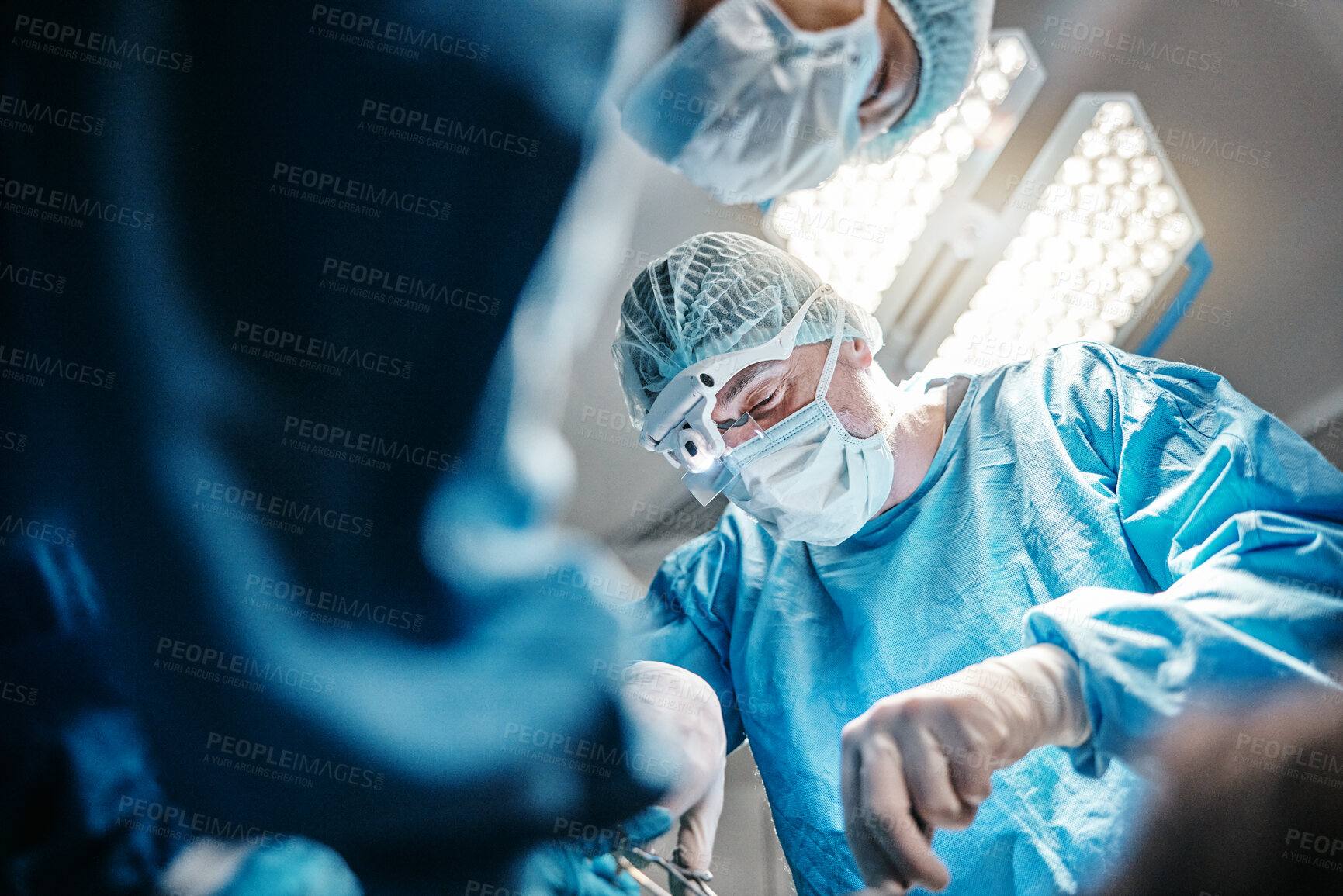 Buy stock photo Hospital, theatre and surgeon with teamwork for surgery and working together for healthcare with mask. Medical, man and group of people as doctors in clinic for service and collaboration with tools