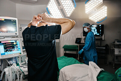 Buy stock photo Surgery, healthcare or doctor with mask in operating room, theater or trauma unit for anatomy emergency. Medical, ppe or man surgeon at hospital with uniform, check or safety for clinician compliance