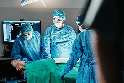 Medical, surgery or doctors in operating room with theater patient or trauma unit for anatomy emergency. Healthcare, support and surgeon team consulting sick man at hospital with empathy and comfort