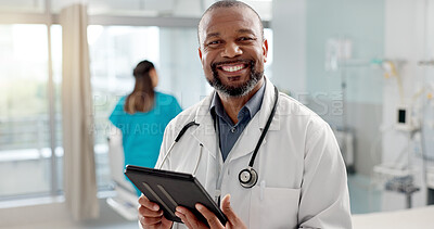 Hospital, face and black man with a tablet, doctor and typing with website info, internet and consultant. African person, portrait and medical professional with tech, clinic and research with email