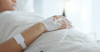 Woman hand, bed and iv drip in closeup, hospital or treatment for hydration, liquid or supplement. Person, healthcare and wellness for blood transfusion, anesthesia or pharma drugs for pain in clinic