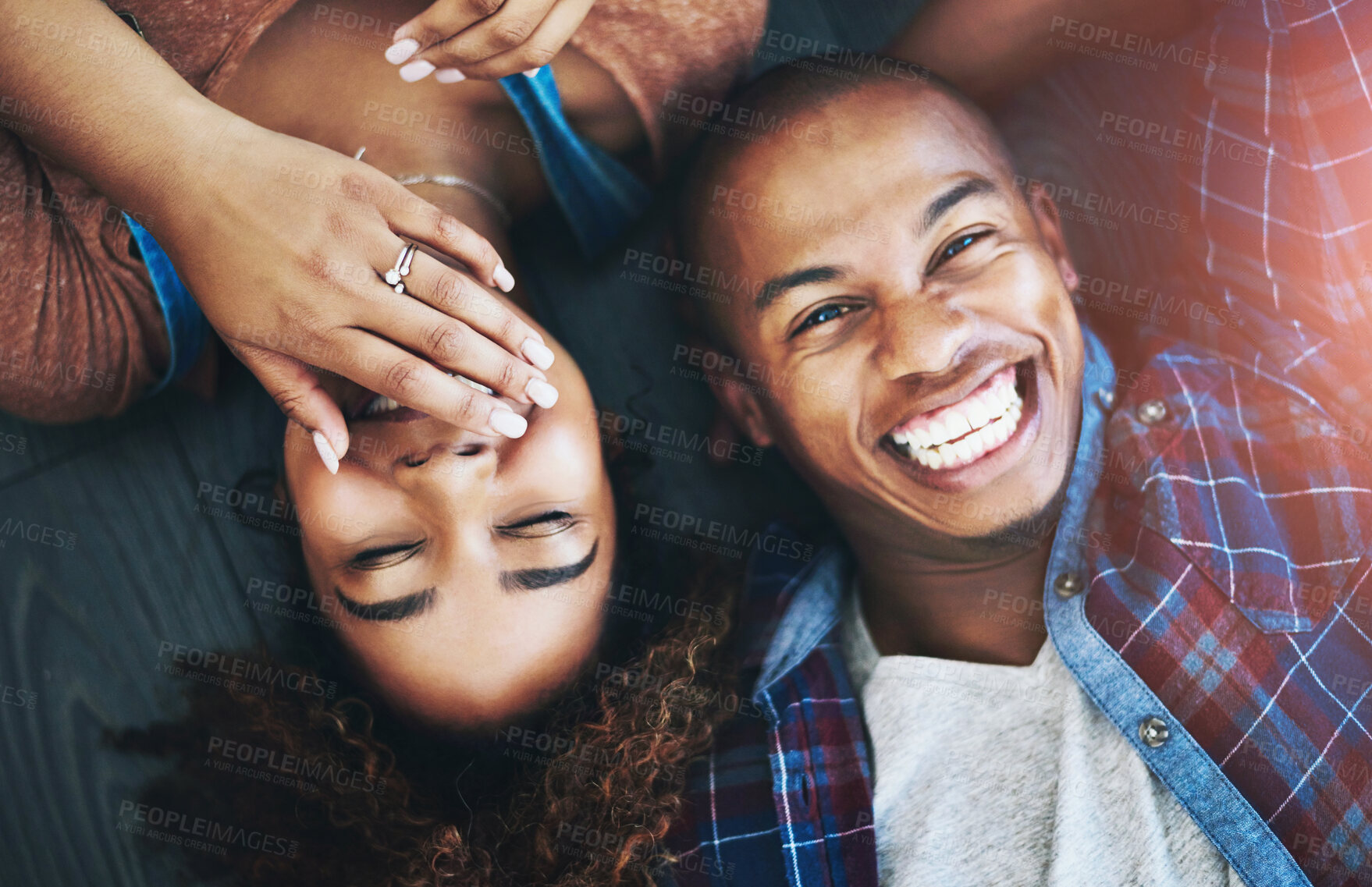 Buy stock photo Love, portrait and funny couple laughing on house floor for fun, humor or bonding with joke, conversation or trust in top view home. Face, comic or happy people in living room with silly discussion