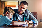 Dad helps him everyday to get his homework done